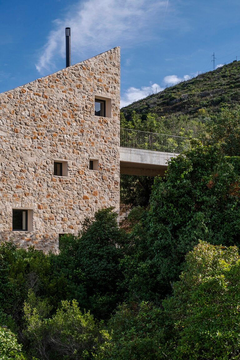 Monolithic stone house by Studio Archaos emerges from verdant site on Croatian island