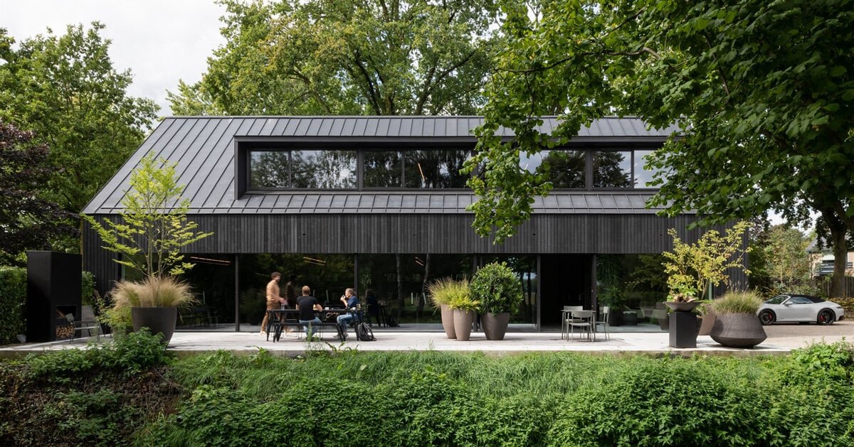 studio] [space nestles black barn-shaped office into the dutch landscape