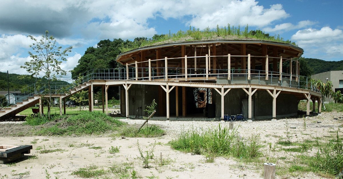 cloud architects weaves circular kiosk into the lush mountainous landscape of japan