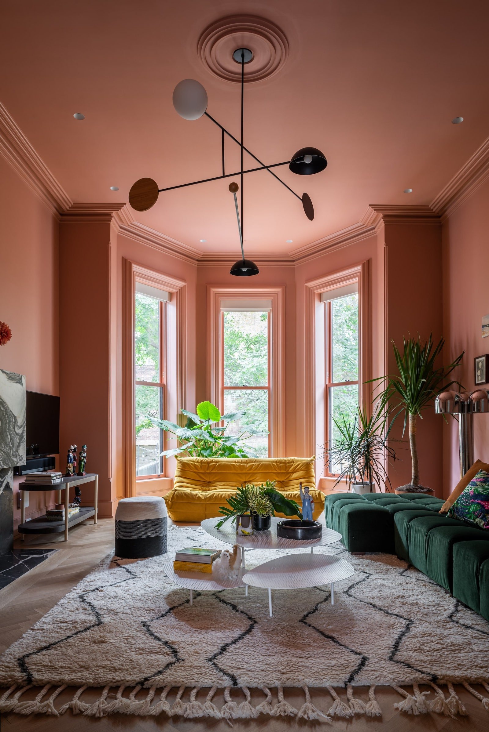 Small Rooms Pink painted living room with bay windows