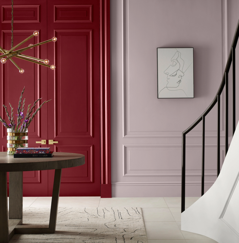 stairwell painted in tones of red and pink