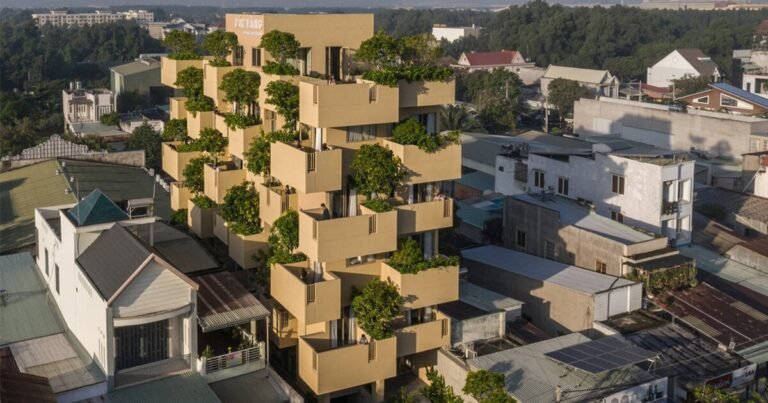 TAA design shapes living complex in vietnam as a matrix of flying blocks & large trees