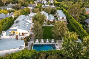 Aerial view of the compound Jennifer Lopez and Ben Affleck with gray roofing large inground pool multiple structures on...
