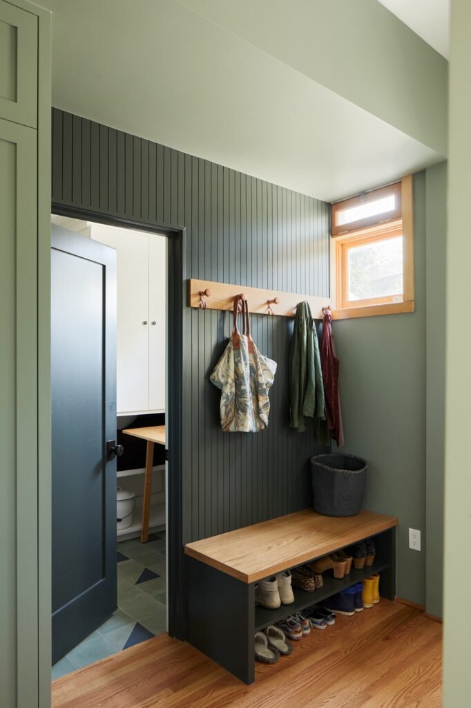 Beadboard and triangular accent tiles appear again in the entryway.