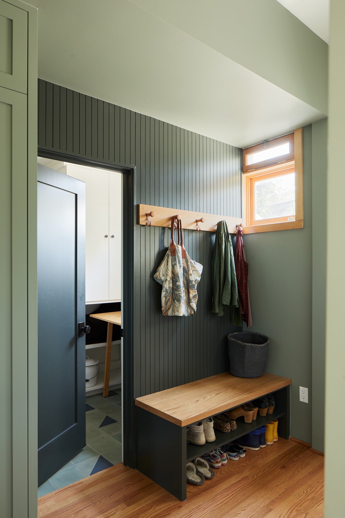 Beadboard and triangular accent tiles appear again in the entryway.