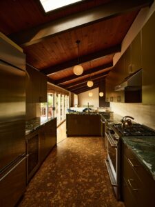 kitchen with cork floor wood ceilings and skylight