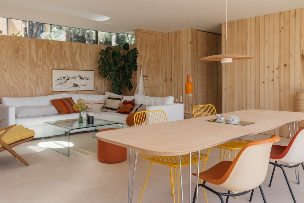 interior of house with orange and yellow chair and white sofa