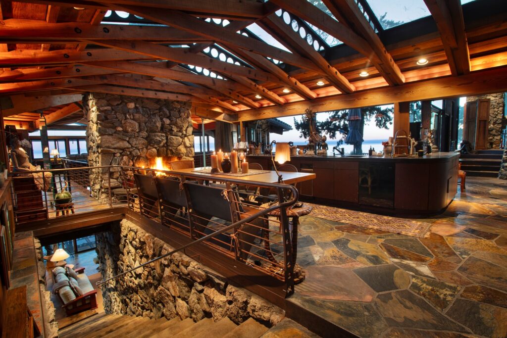 upper floor of home skylights timber trusses stone floors