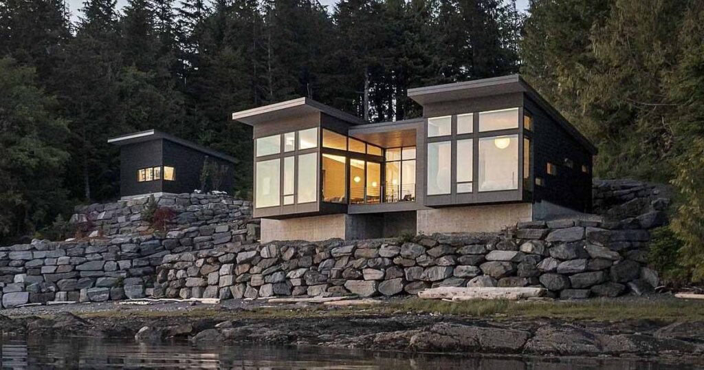 A New Home Overhanging The Water's Edge In Alaska