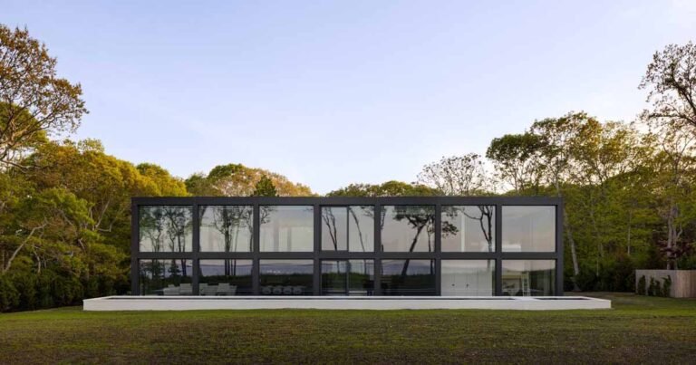 A Grid Of Large Windows Maximizes The Water Views At This Modern Home