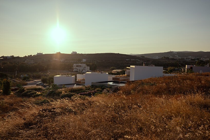 cubic volumes emerge from tinos’ rugged terrain in 'pnoes' hotel by aristides dallas architects