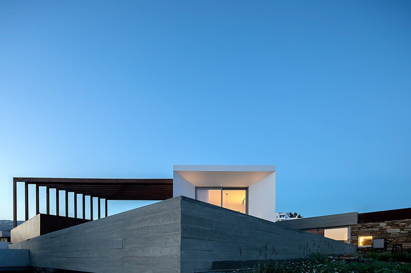 cubic volumes emerge from tinos’ rugged terrain in 'pnoes' hotel by aristides dallas architects