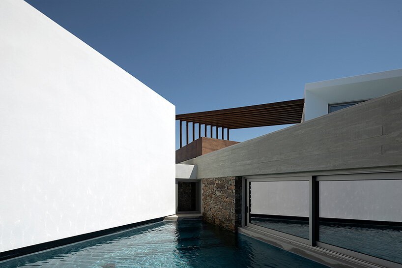 cubic volumes emerge from tinos’ rugged terrain in 'pnoes' hotel by aristides dallas architects