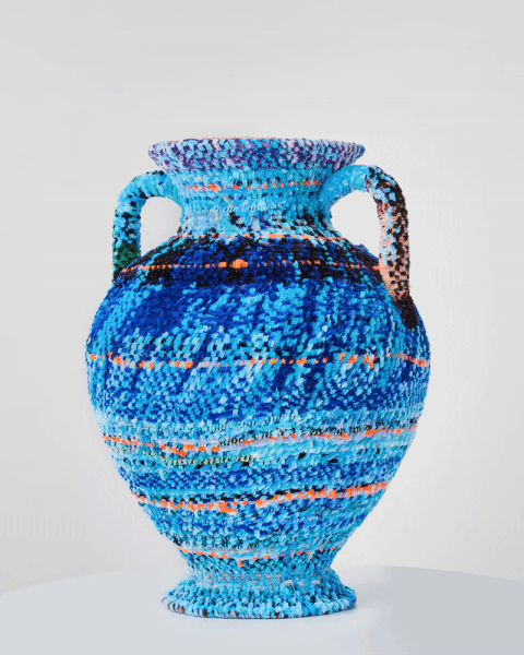 a 360 degree gif of a vase made from woven pipe cleaners in shades of blue