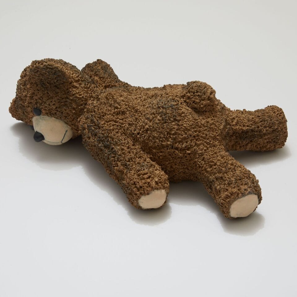 a ceramic sculpture of a teddy bear