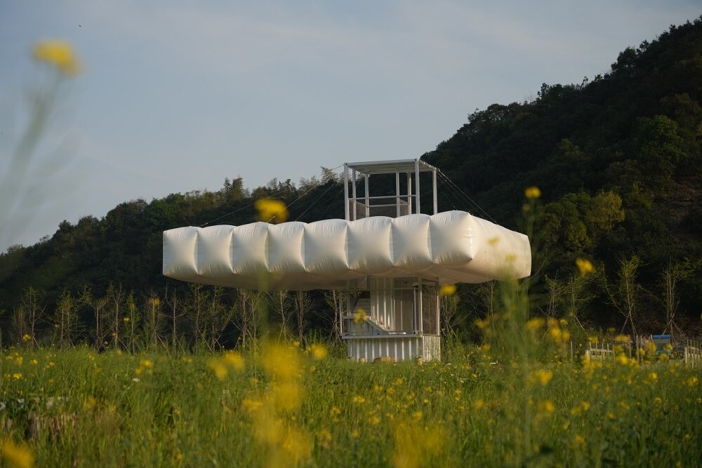 trio of inflated pavilions create rural café, cinema, and library amid rice fields in china
