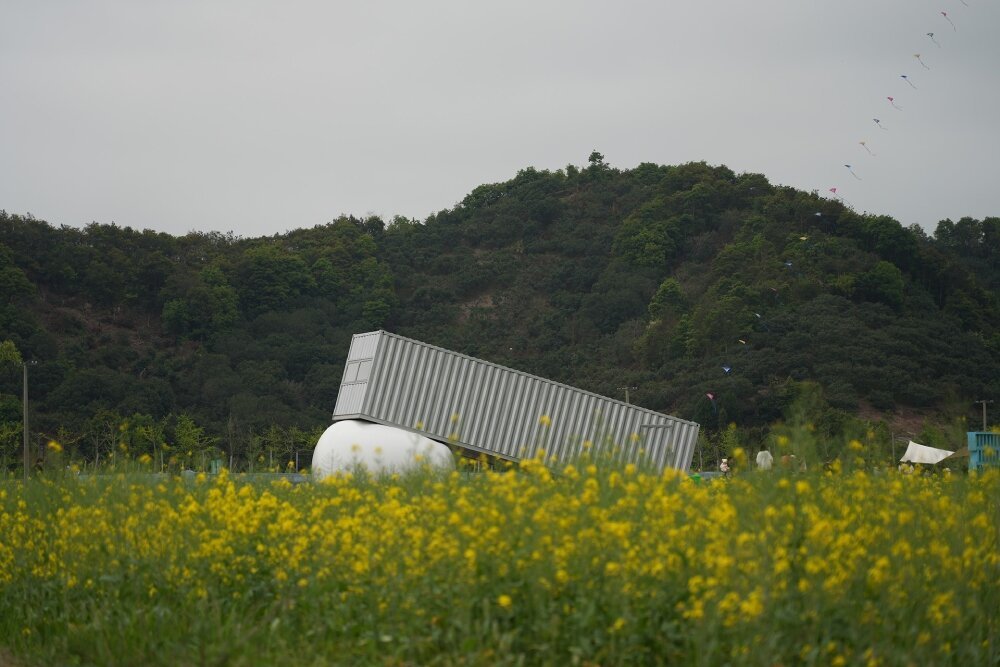 trio of inflated pavilions create rural café, cinema, and library amid rice fields in china