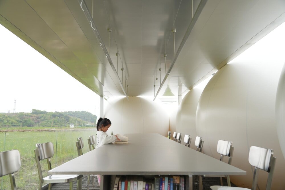 trio of inflated pavilions create rural café, cinema, and library amid rice fields in china
