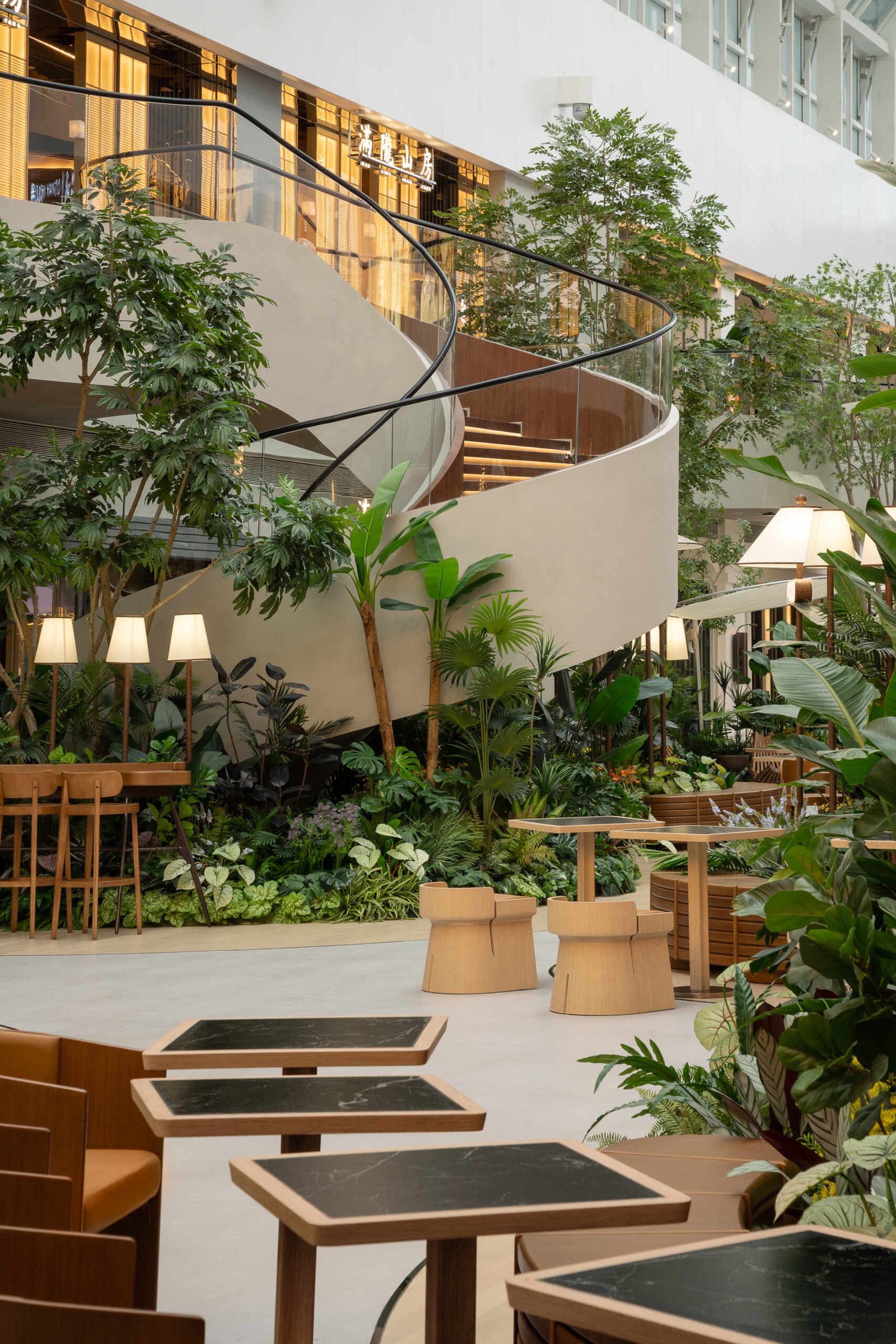  A vine-like spiral staircase rises gracefully through the atrium, serving as both a sculptural element and a gentle transition between floors. Light, fluid, and rooted in the garden aesthetic.Under-stair lighting adds a gentle glow to each tread, guiding movement without disrupting the calm atmosphere. Subtle, functional, and beautifully integrated into the space.