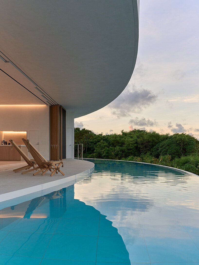 sou fujimoto's circular green-roofed villa for NOT A HOTEL opens on ishigaki island, japan
