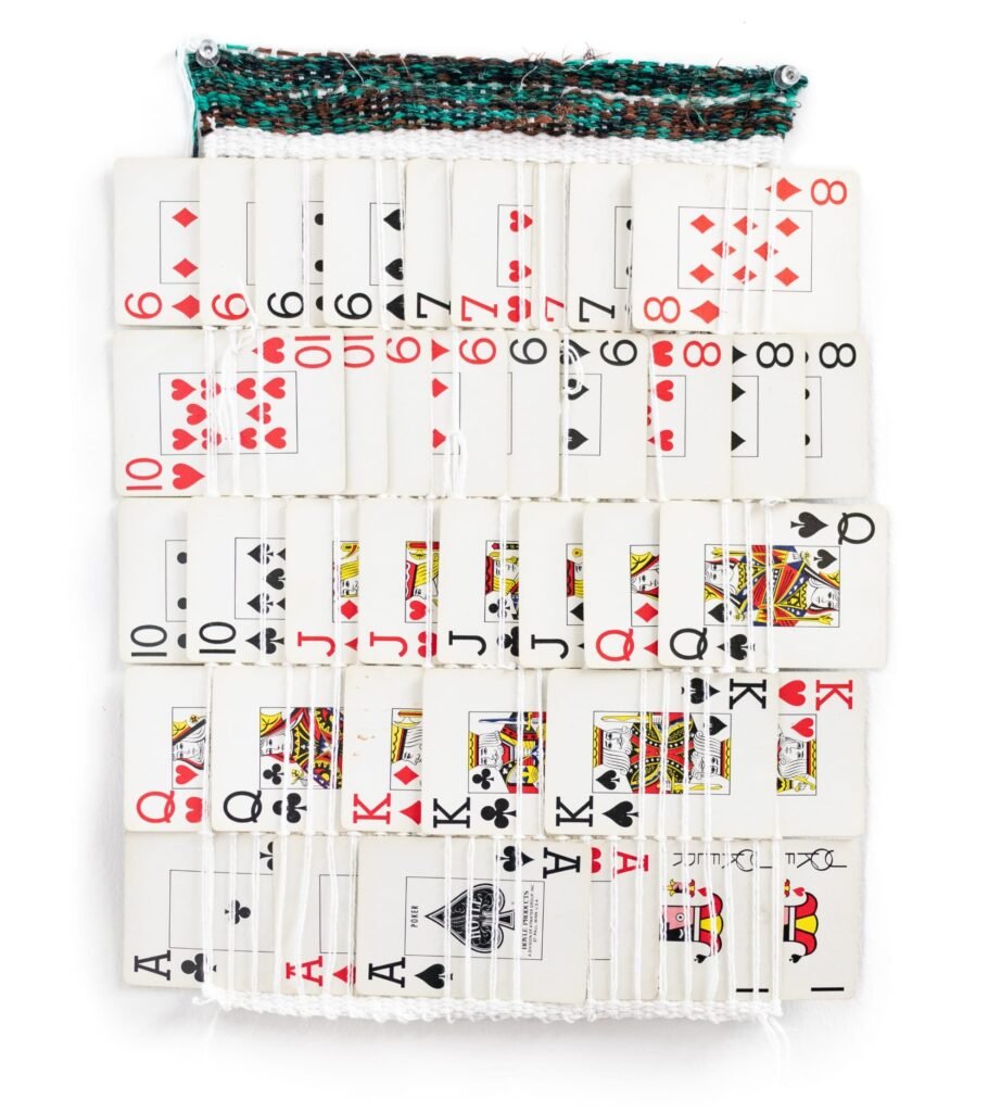 a weaving with a deck of cards