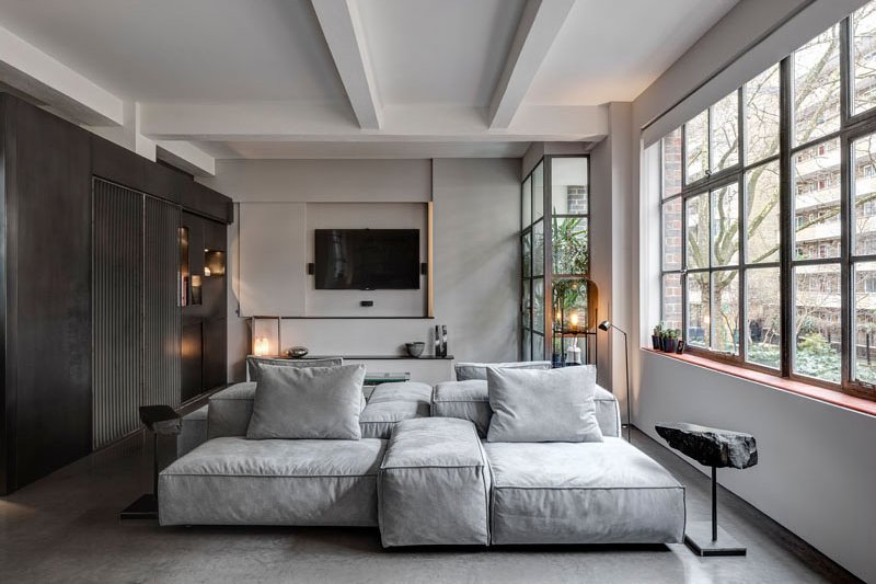 A 1930s shoe factory was converted into a contemporary apartment filled with industrial character and highly personal design details.
