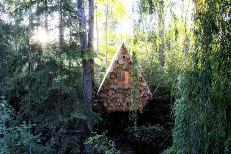 A tiny treehouse in the forests of Canada that’s also home to local birds. Designed by Studio North, the Birdhut blends into the canopy with its whimsical design, reclaimed materials, and built-in birdhouses that let humans and wildlife share the same space.