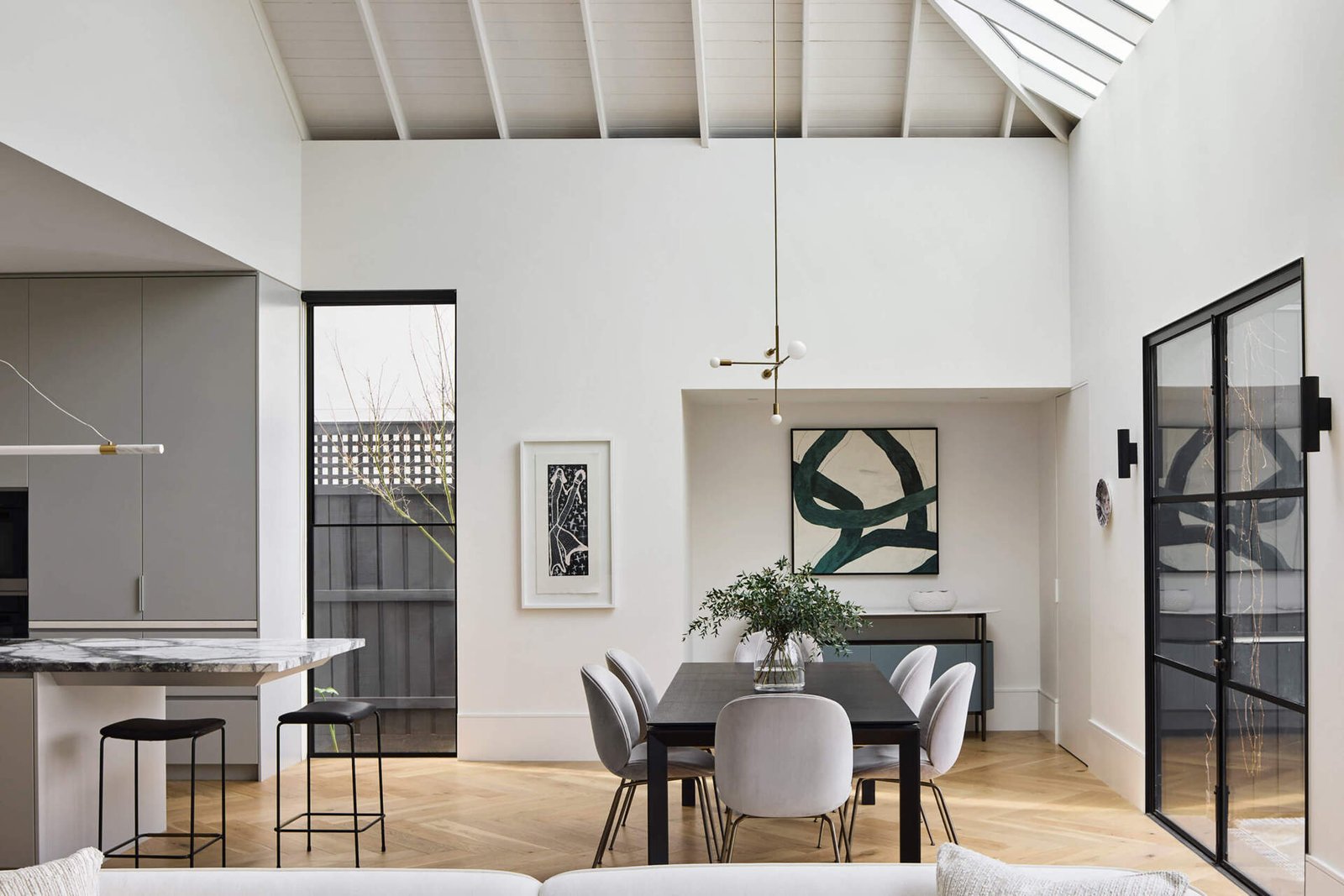Open-plan living and dining bring warmth and refinement to this Australian family home.