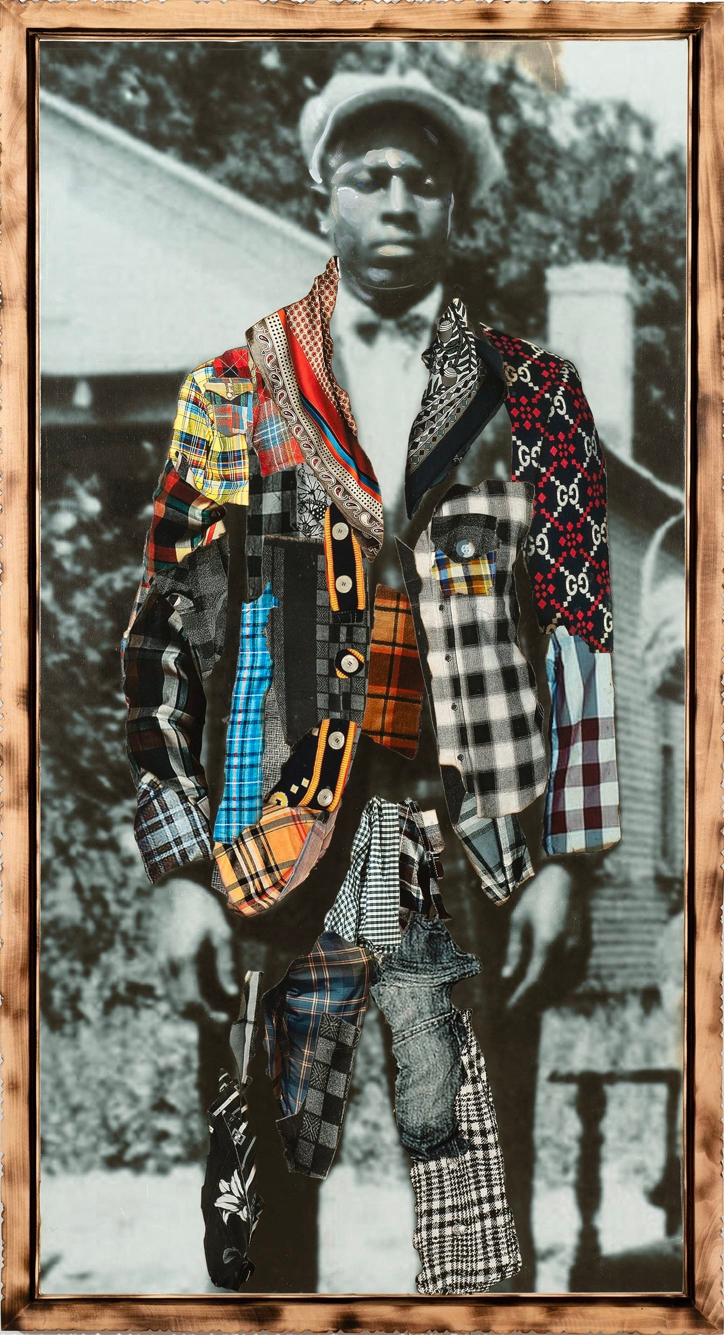 a framed portrait by Stan Squirewell, from an old photograph, of a Black man with colorful, patterned fabrics collaged onto the image