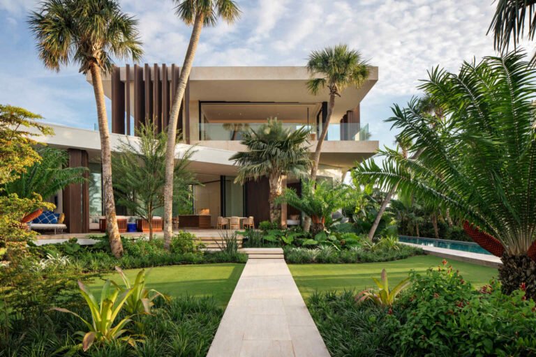 A calm Bahamian villa where coral stone, tropical gardens, and canal side views shape every room.