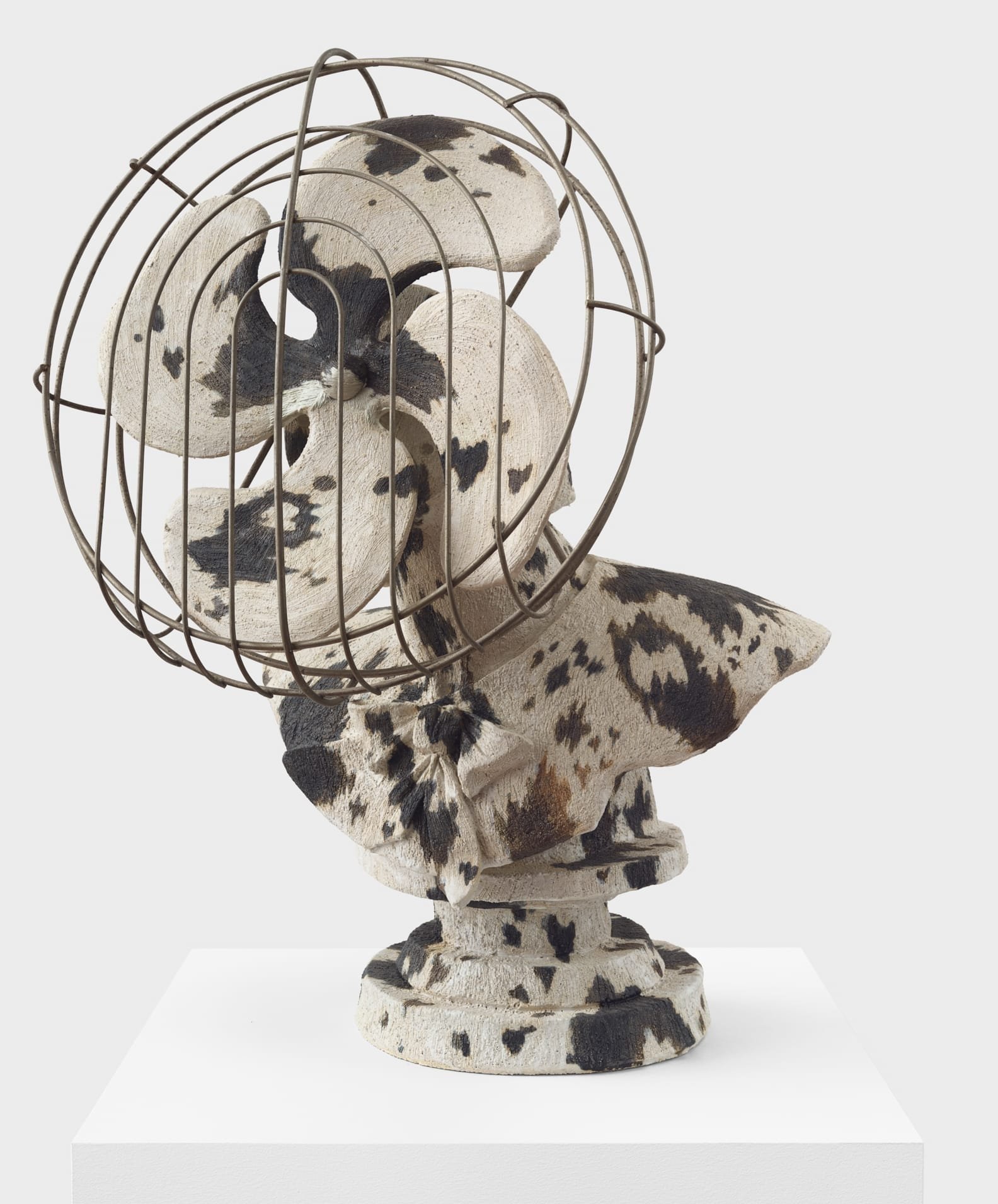 a ceramic sculpture by Stephanie Temma Heir of a cow-printed bust-turned-fan
