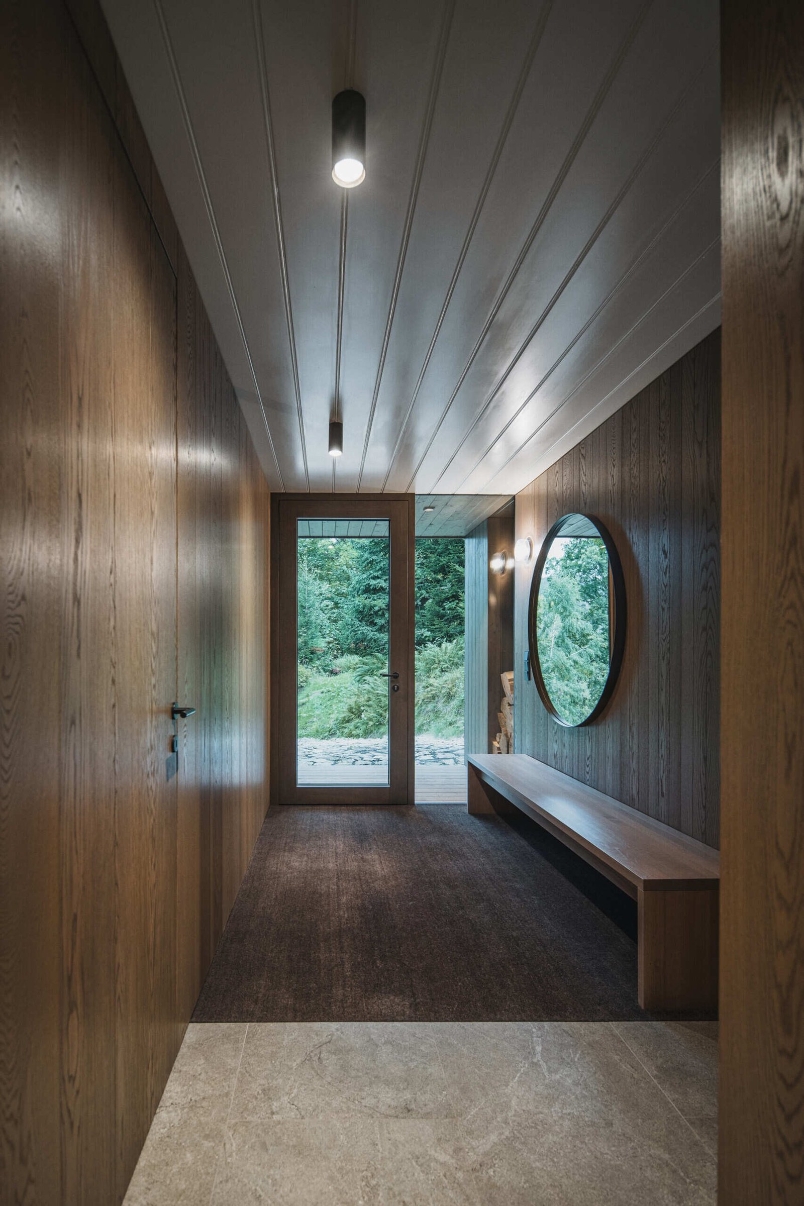 Mountain cottage porch combines shelter, charm, and hidden storage for practical mountain living.