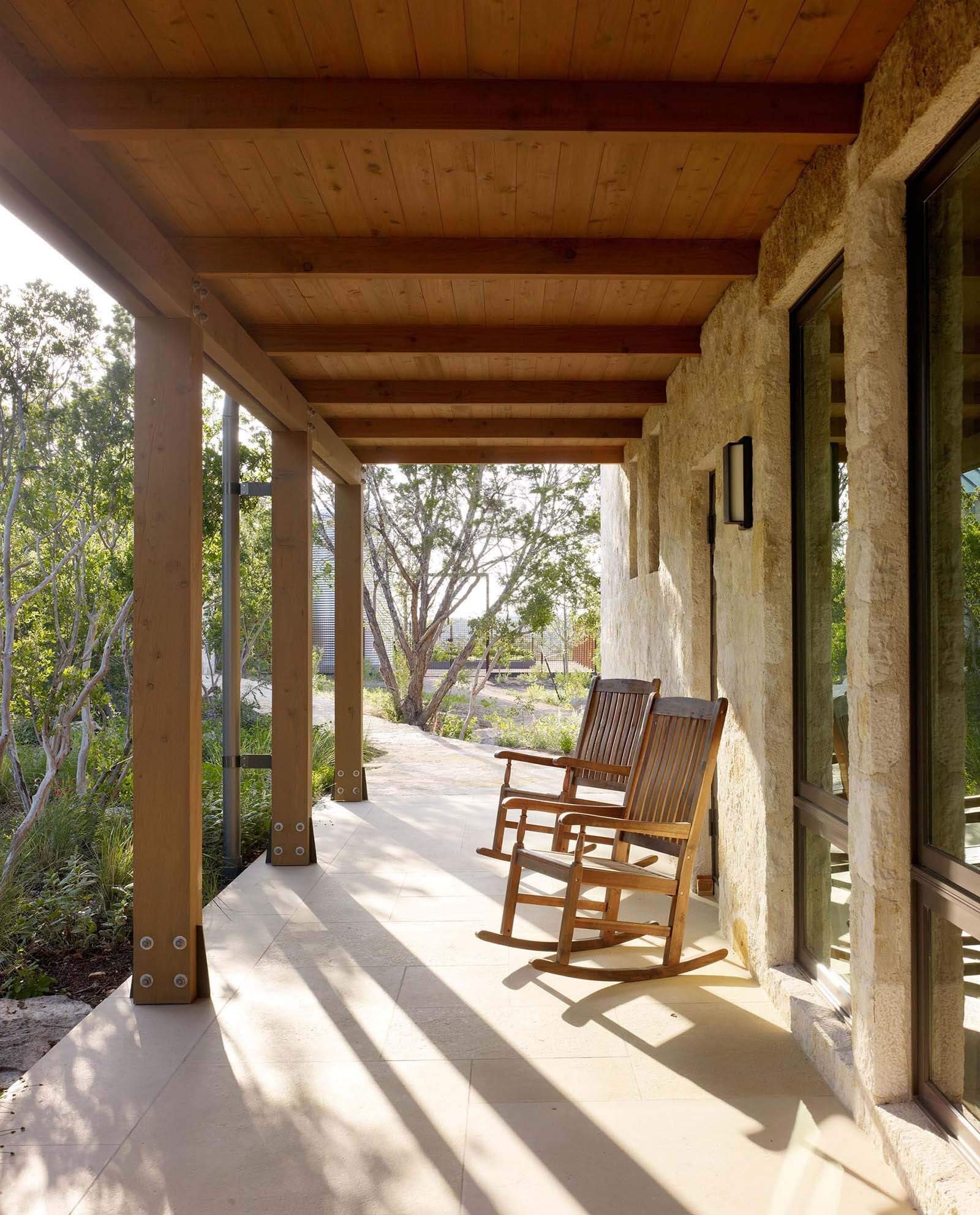 Covered outdoor spaces extend the home’s living areas, offering shaded spots to relax and enjoy the surrounding Texas landscape.