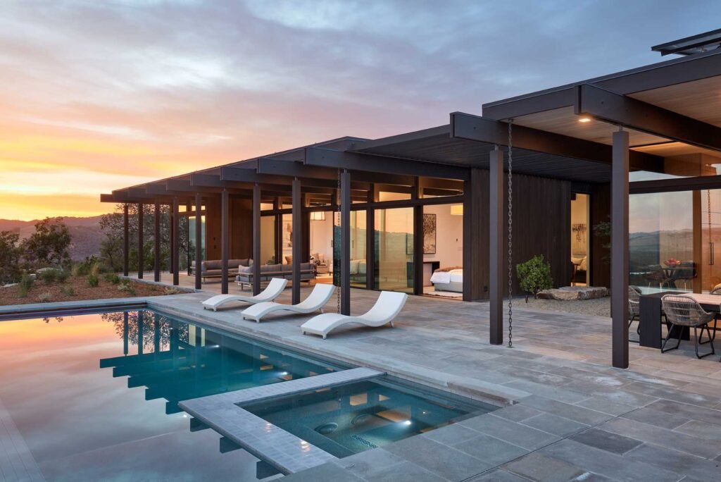 A Sonoma Valley home by Klopf Architecture brings mid-century modern inspiration into the 21st century with expansive views, exposed beams, and seamless indoor-outdoor living.