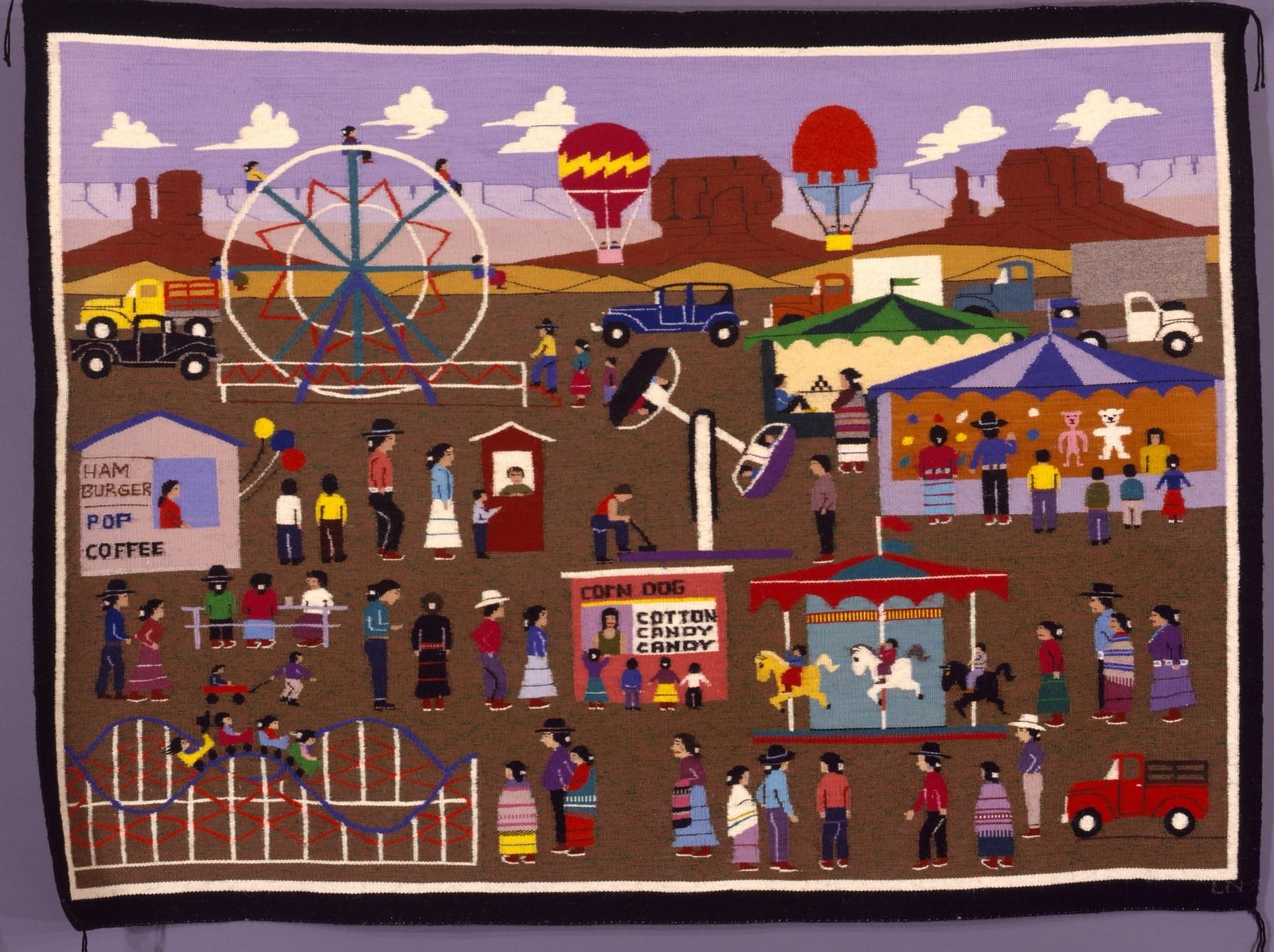 a woven textile depicting people in the desert at a carnival