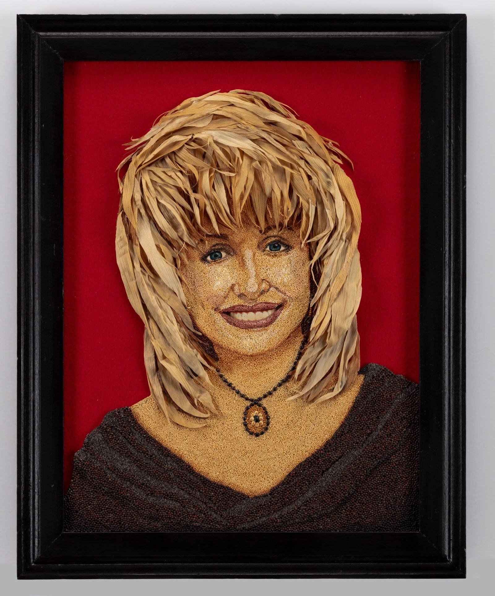 a seed art portrait of Dolly Parton