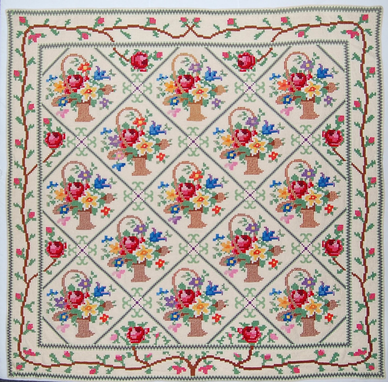 an elaborate basket petit point quilt from the 1940s