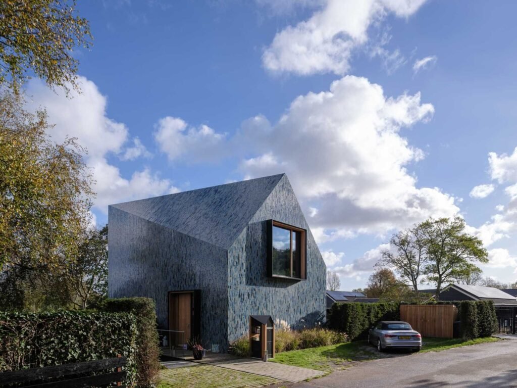 This Blue-Tiled Home Changes Color as the Light Moves Across It