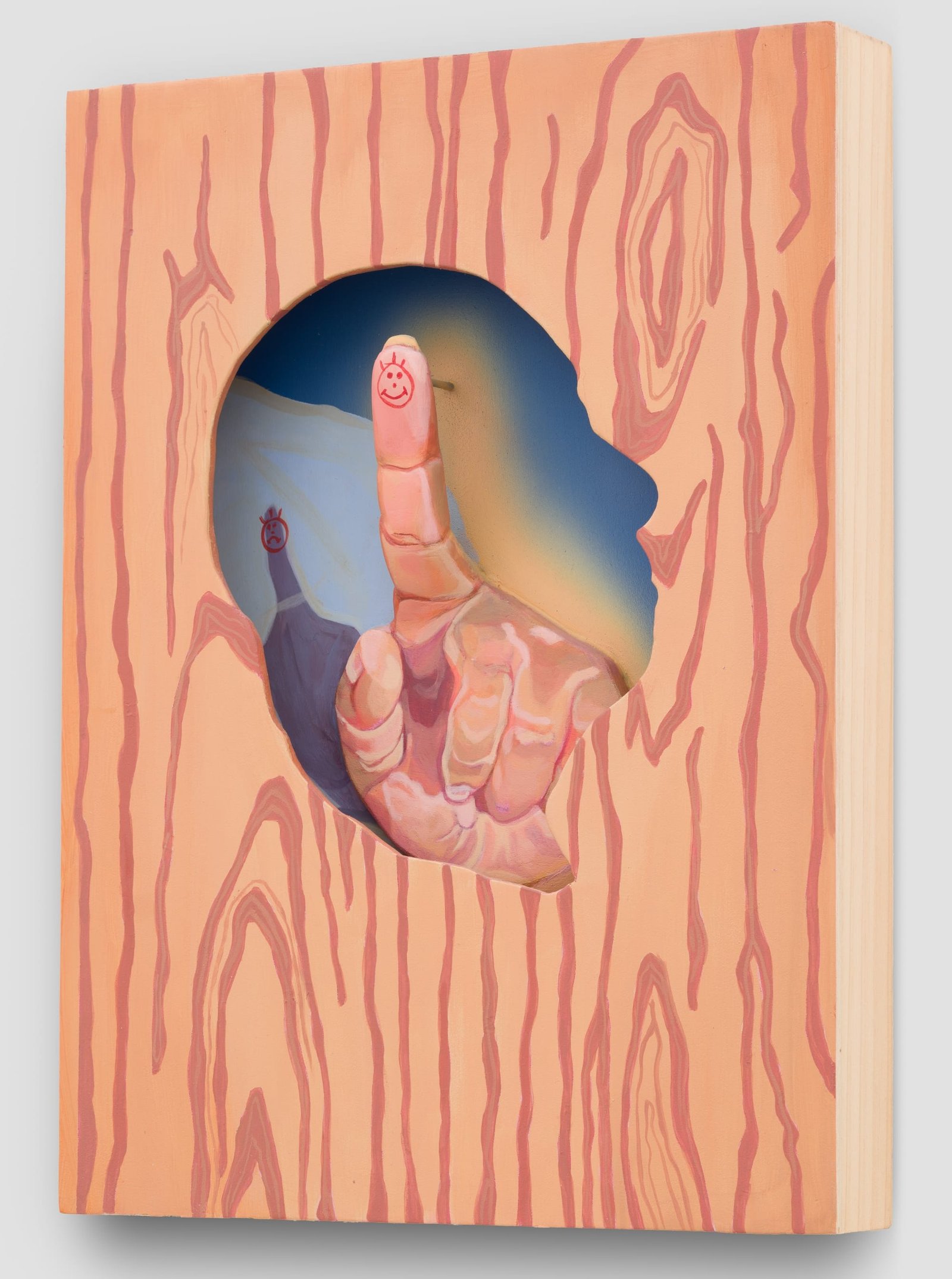 a sculptural painting by Estefania Ajcip of wood with a silhouette cut out and a finger in the center