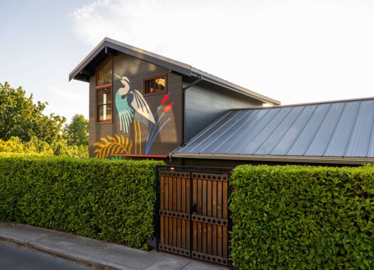 Tour Alki Lookout, a colorful 1910 home above Alki Beach in West Seattle, renovated by SHED Architecture & Design with warm timber, playful tile, clever built-ins and panoramic Puget Sound views.